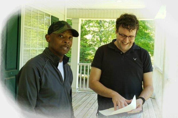 Sell my house fast in Woodstock, GA to Resideum's Brent Bagley pictured with a homeowner whose house we bought as-is in 21 days.